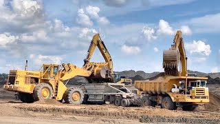 Clark 475C and PayHauler 350Cs with bottom dump trailers working on highway project [upl. by Stacia]