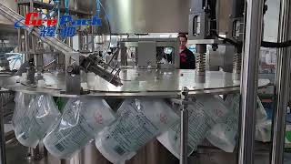 Grepack 125L rotary spout doypack premade pouch liquid fermented milk filling capping machine [upl. by Luana]