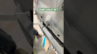 Laying seam sealer on this BMW after replacing the rear body panel seamsealer autobody collision [upl. by Larine]