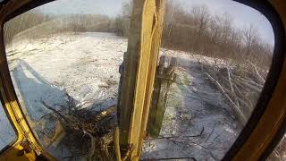 Dynahoe backhoe clearing bush [upl. by Ellingston124]