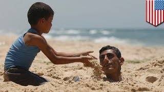 Sand tunnel collapse kills man on popular North Carolina beach [upl. by Loftus]