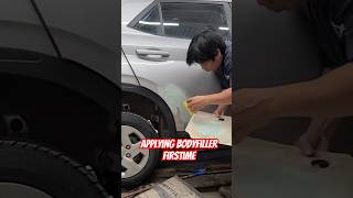 Applying bodyfiller Car body Repair Denting and painting auto car automotive automobile [upl. by Calvina]