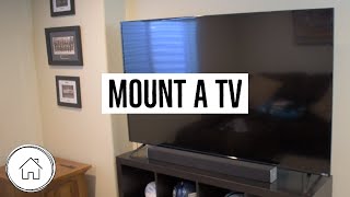 DIY Mount a TV on the wall  for beginners and SUPER easy [upl. by Harrietta39]