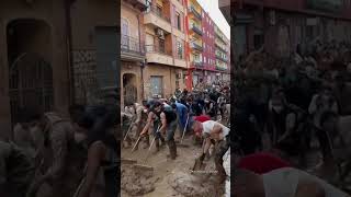 Volunteers sweep water after DEADLY Spain floods [upl. by Willem710]