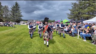 Drum Major Dyer leads Aberlour Pipe Band playing on the march during 2024 Dufftown Highland Games [upl. by Aynod505]