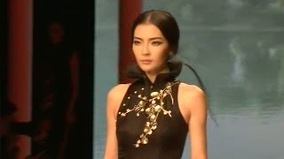 Traditional Chinese Qipao dress featured at Beijing fashion show [upl. by Edita]