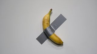 Banana taped to a wall sells for 62 mn in New York  AFP [upl. by Ferrel54]