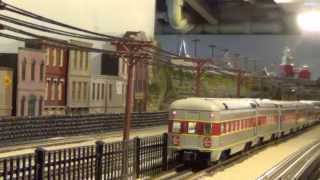 Erie Lackawanna O Scale HiRail Layout  Passanger and Freight Pass Near the Station [upl. by Aleuqahs325]