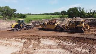 Scrapers taking down the hill MTS 3630T tractor push loading [upl. by Gurtner423]