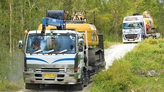 CAT 320D Excavator Transport By Self Loader Truck Fuso And Quester UD Trucks [upl. by Eybbob710]