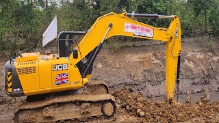 Machine is constructing the bottom of the bridge across the river [upl. by Shore]