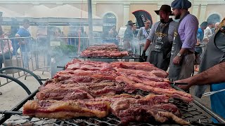 Churrasco gaúcho na rua 500 kg de costela 300 kg de linguiça ovelha na estaca e paella campeira [upl. by Eiboh603]