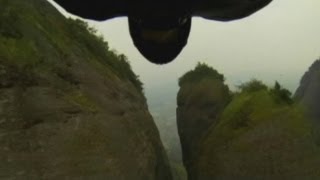 AMAZING Jeb Corliss performs flying dagger through 4metrewide valley in China at 160KPH [upl. by Truda]