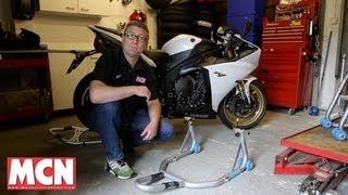 How to Use a paddock stand  Products  Motorcyclenewscom [upl. by Sacks534]