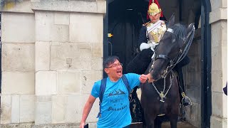 This RUDE Tourist Tries To Annoy The Kings Guard Horse BIG MISTAKE [upl. by Elvera]