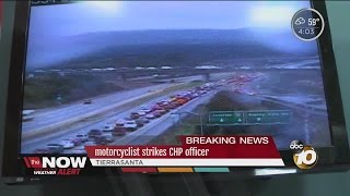 Motorcyclist strikes CHP officer [upl. by Ahsaeyt]