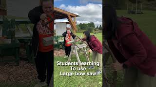 Students learning to use large bow saw at Barefoot Bushcraft [upl. by Arihaz452]