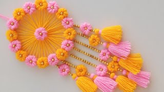 DIY Easy Woolen Flower wall hanging craft ideasWoolen wall hangingWoolen craftWoolen torantoran [upl. by Ilocin905]