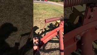 Raking hay with a 256 rolabar hay rake farming [upl. by Julina580]