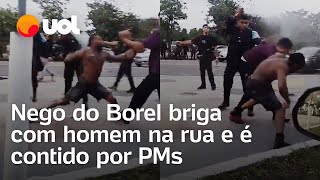 Nego do Borel troca socos com homem na rua e é contido por PMs [upl. by Scholz182]