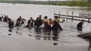 WATCH Wedding party falls into lake when dock collapses [upl. by Tikna]