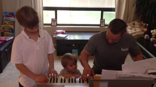 Chris Powell Family Singing Around the Piano [upl. by Jacintha826]