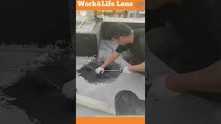 Worker applies bitumen sheets to flat roof holes fusing with heat for waterproofing [upl. by Llerroj]