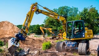 Bagger ATLAS 140W mit OilQuick [upl. by Iur413]