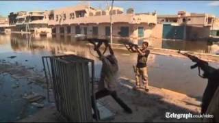 Libya fighters continue battle against proGaddafi resistance [upl. by Cohl603]