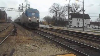 Metra Inbound Train meets Hiawatha lead by Amtrak 127 in Morton Grove IL [upl. by Cristen]