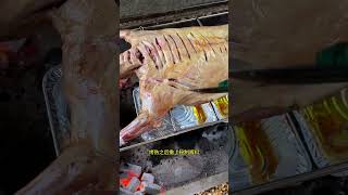 Freshly roasted whole lamb is steaming and sizzling meat roast food barbecue delicious [upl. by Elstan]