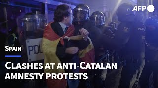 Police clash with protesters opposed to Catalan amnesty bill in Madrid  AFP [upl. by Cirenoj99]