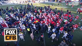 Massive SCUFFLE ensues after Michigan tries to plant flag on Ohio States logo [upl. by Aldercy]