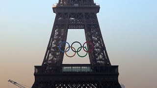 Paris organisers unveil five Olympic rings mounted on Eiffel Tower [upl. by Negyam]