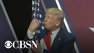 Trump hugs and kisses the American flag at CPAC 2020 [upl. by Tterab]