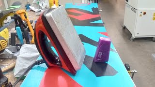 Applying wax to a snowboard with a Swix iron [upl. by Assila365]