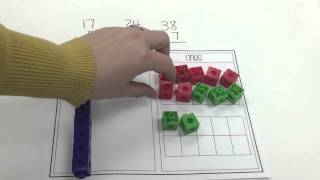 Addition with Regrouping using Manipulatives [upl. by Htederem456]