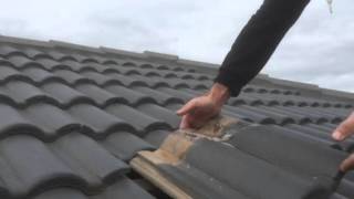 How to change a concrete roof tile [upl. by Salhcin]