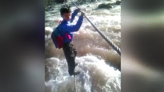 Children cross rapids just to get to school [upl. by Stinky]