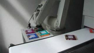 HHN  RV6SL Robot tracking Ritter Sport chocolate on a conveyor belt with vision system [upl. by Ymmor161]