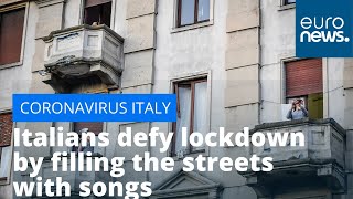 Watch Italians defy coronavirus lockdown by filling the streets with song [upl. by Xyla]