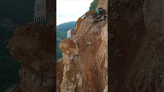 Excavators cut through the mountains to build roads [upl. by Nosneh]