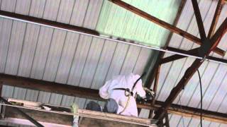 Closed cell Spray foam insulation being applied to a auto shop [upl. by Wait247]