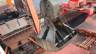 Unloading a 300 meter coal bulk ship Bucket crane with massive bucket close to the wheelhouse [upl. by Bascio886]