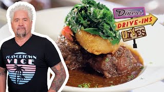 Guy Fieri Eats African Caribbean Goat Stew in Santa Fe  Diners DriveIns and Dives  Food Network [upl. by Pellet]