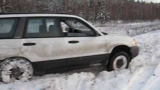 Subaru Forester in snow get two wheels off the ground [upl. by Sculley]