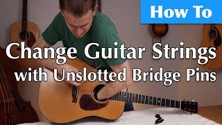 How To Change Your Acoustic Guitar Strings Using Unslotted Bridge Pins [upl. by Shipley970]