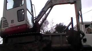 Takeuchi TB016 Loading Lorry with Topsoil [upl. by Amalle]