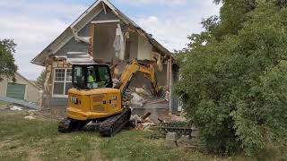 Caterpillar Cat 305 Mini Excavator destroys house [upl. by Ymmor]