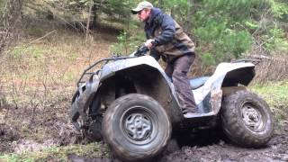 2006 Brute Force 750 4x4i diff lock in mud [upl. by Ashton96]